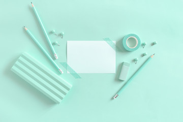 White paper mockup and set of mint stationery