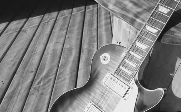electric guitar on the wooden boards at old barn