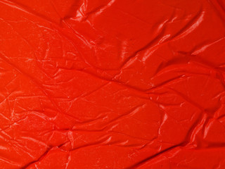 Fototapeta premium Close-up crumpled red paper background