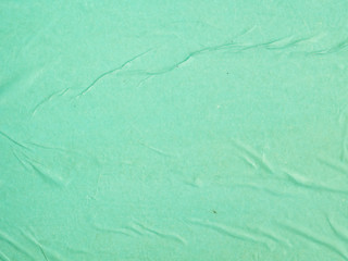 Close-up green crumpled paper background
