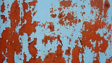 texture of old metal sheet with red rust and cracked blue paint