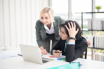 Fototapeta premium Business man and business woman are analytics business data, business plan concept