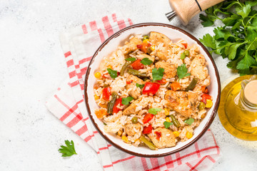 Rice with chicken and vegetables top view.