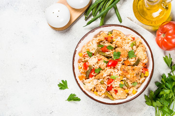 Rice with chicken and vegetables top view.