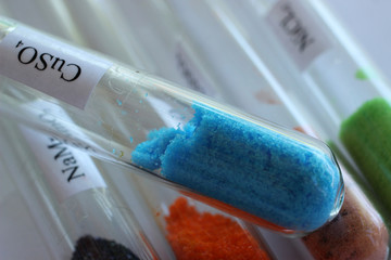 Blue crystals of copper sulfate in test tube. The substance is used in chemistry and in agriculture...