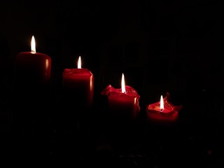 red candles in the christmas time on the fourth advent