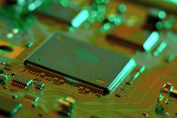 Electronic circuit board close up. Blurry background.