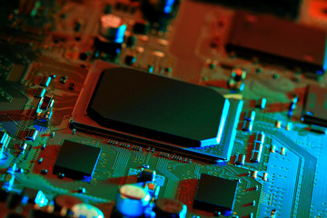 Electronic circuit board close up. Blurry background.