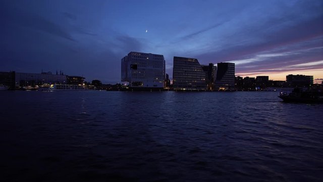 4K-UHD: Boad trip over Ij in Amsterdam, Netherland an night  near a party boat
