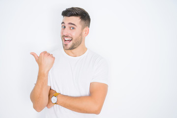 Young handsome man wearing casual white t-shirt over white isolated background smiling with happy...