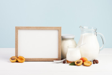 Wooden copy space frame and dairy products