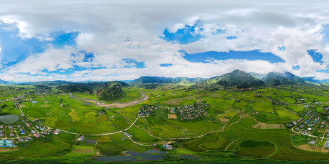 360 panorama by 180 degrees angle seamless panorama view of Fansipan mountain with paddy rice terraces, green agricultural fields in rural area, hills valley, Vietnam. Nature landscape background.