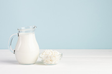 Jar filled with milk and cheese in bowl