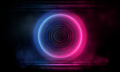 Neon circle on a dark street background, wet asphalt. Blue neon, smoke, smog. Night view of a street with neon. Abstract neon dark background.