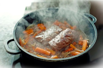 fresh fillets from red deer roasted with vegetables