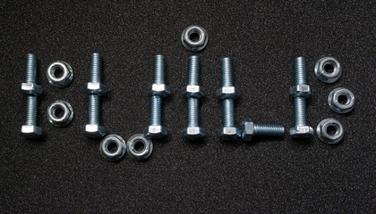 Word build of bolts and nuts on black background