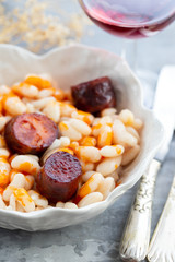 white beans with smoked sausage on beautiful dish