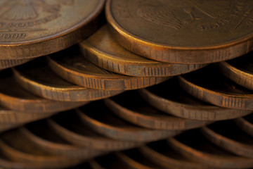 Piles of Russian coins. Dark background with low contrast