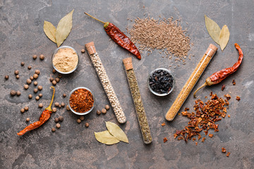 Different spices on grey background