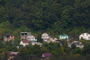 Village in the forest at the foot of the mountain