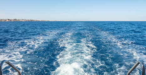 motorboat foam trace wave on the ocean