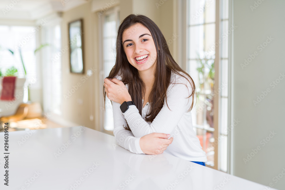 Poster beautiful young brunette woman smiling cheerful looking at the camera with a big smile on face showi