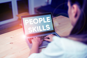 Conceptual hand writing showing People Skills. Concept meaning Get Along well Effective Communication Rapport Approachable woman with laptop smartphone and office supplies technology