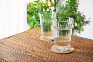 Glasses of fresh water on table indoors