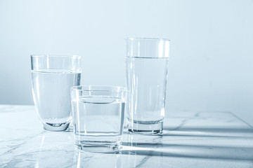 Glasses of fresh water on table