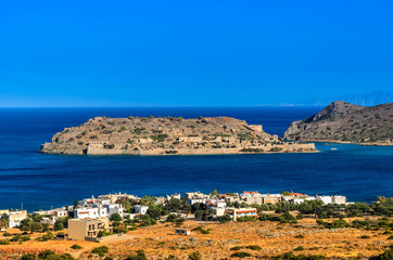 Fototapeta na wymiar The famous island of Spinalonga, the leper colony and fortress at Plaka, Elounda bay of Crete island in Greece.