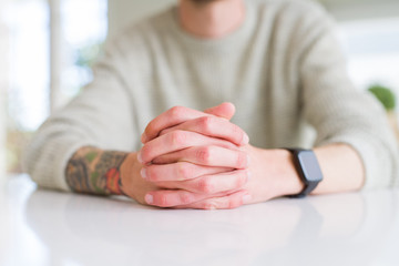 Close up of man hands over white table