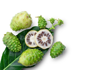 Fresh noni fruit or morinda citrifolia (common name as indian mulberry, cheese fruit) and horizontal slice with green leaf isolated on white background. All in focus. Clipping path.Copy space for text