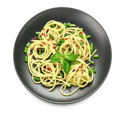 Plate with tasty pasta on white background