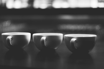 Cups with coffee on the table