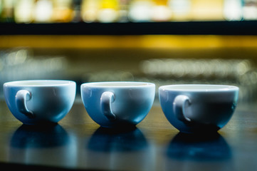 Cups with coffee on the table