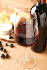 Glass of tasty wine on table, closeup