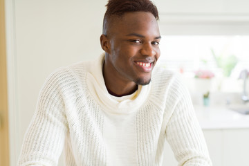 Handsome african young man smiling cheerful with a big smile on face