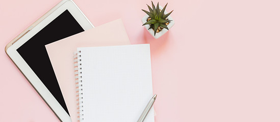 Top view of a flat lay of  desktop and notepads for writing down goals and plans. 2020 New Year's...