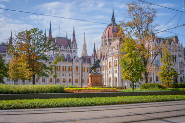 Street of Budapest with a view at the Hungarian Parliament Building on a bright autumn day 