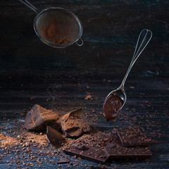 dark chocolate over wooden background