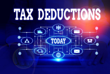 Writing note showing Tax Deductions. Business concept for an amount or cost that subtracted from someone s is income Woman wear formal work suit presenting presentation using smart device