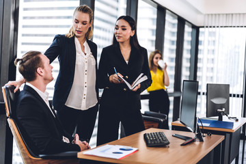 Group of professional business meeting and discussing strategy with new startup project.Creative business people planning and brainstorm with document report in modern workloft.Teamwork concept