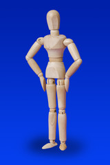 Dancing wooden toy figure on blue