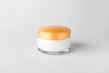 Jar of cosmetic cream on white background