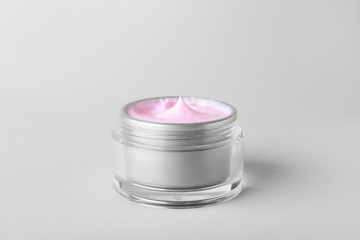 Jar of cosmetic cream on white background