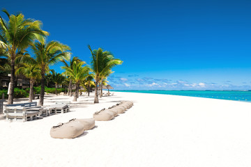 Tropical scenery - beautiful beach with blue ocean and clear sky of Mauritius island