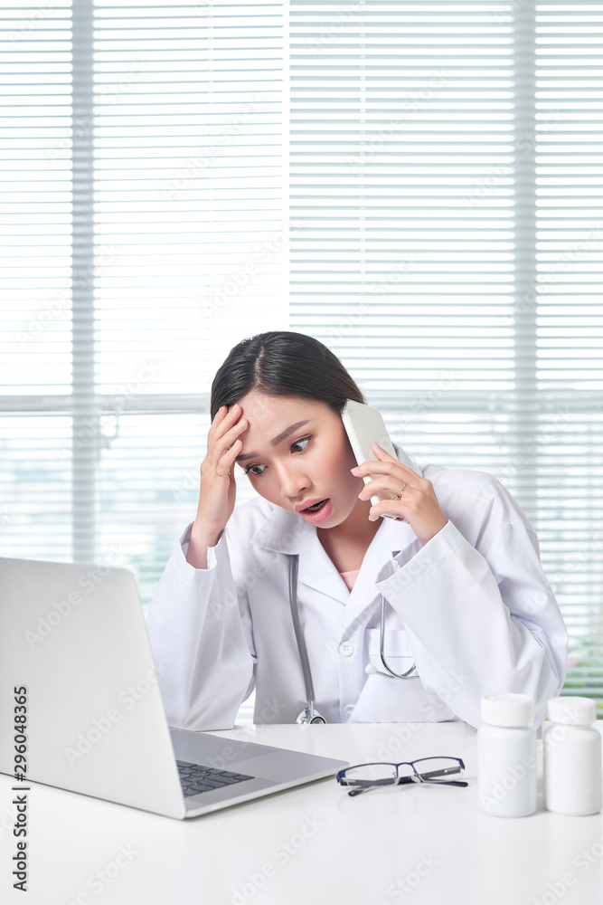 Wall mural woman medical staff calling coworker nurse to ask problem of patient.