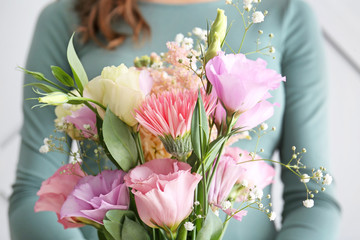 Woman with bouquet of beautiful flowers, closeup