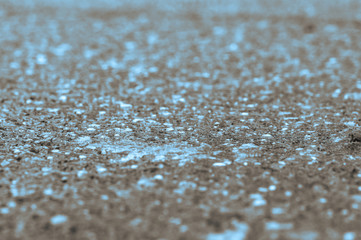 Turquoise spots on black background. Digital texture fill. Blue spots on a grey background.