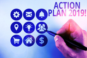 Conceptual hand writing showing Action Plan 2019. Concept meaning proposed strategy or course of...